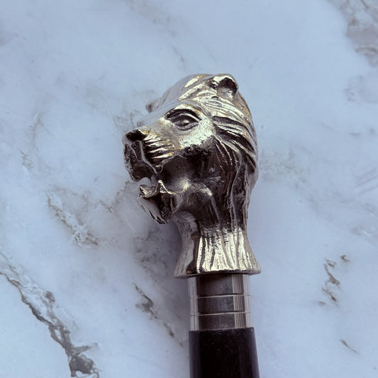 Decorative walking cane with a lion head finial